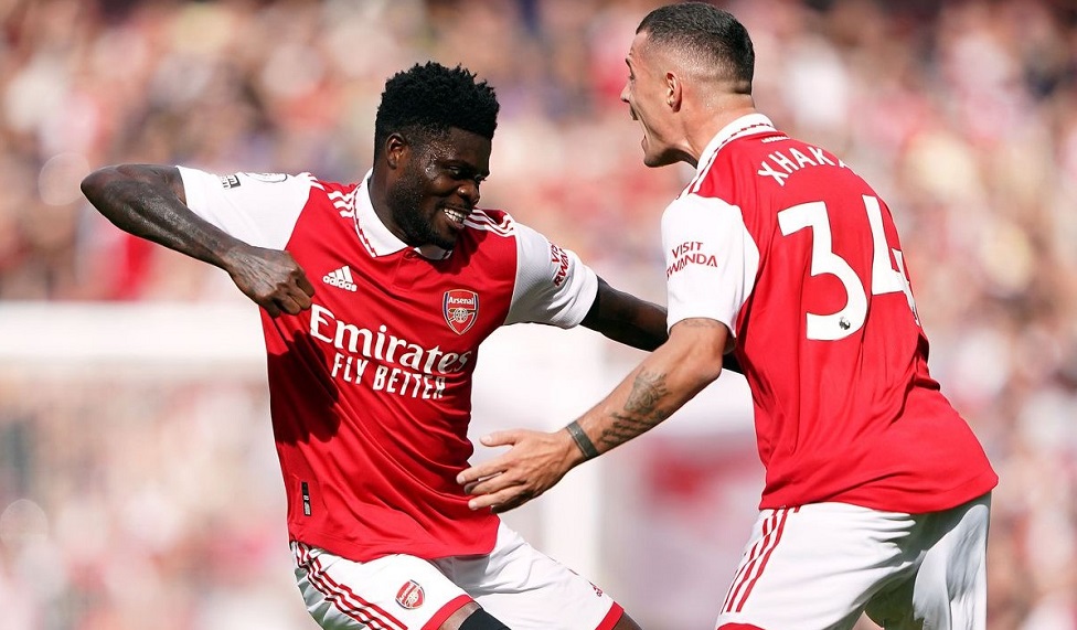 Arsenal's Ghanaian midfielder Thomas Partey (left) celebrates his goal with teammate Granit Xhaka